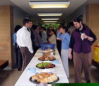 Buffet table with lunch and students/faculty lined up on both sides to collect food