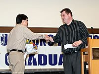 Kevin King congratulates Guthrie Prize winner Kenny Karyadi