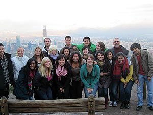 Photo: Students and Jaime Olavarria check out some of the beautiful vistas from a viewpoint about Santiago, Chile.