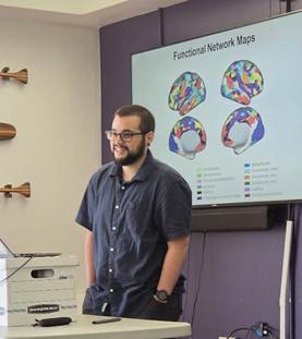 Photo of Cognition and Perception graduate student, John Romero, presenting at the 2026 Psychology Department Research Festival 