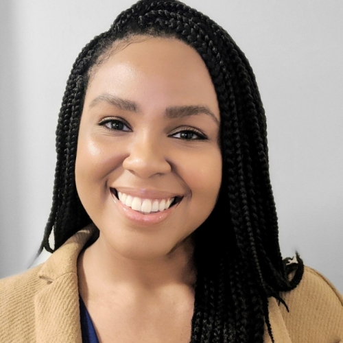 headshot of Michele Smith against a gray background