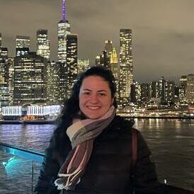 Night photo of Alice Smaniotto Aizza with city in background